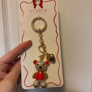 Studio Gold Teddy Bear Keychain with Red Accents